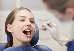 Young girl receiving children's dentistry exam