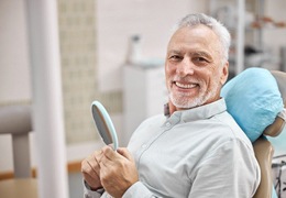 smiling man sitting in the dental chair