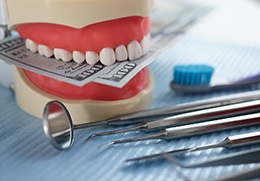 money and dental instruments (for flexible payment options section)
