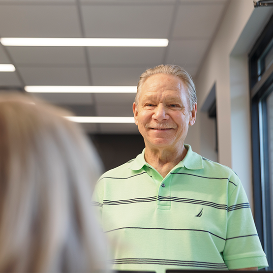 Man checking in at dental office front desk