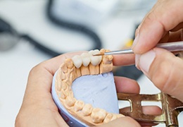 dental specialist working on a dental bridge