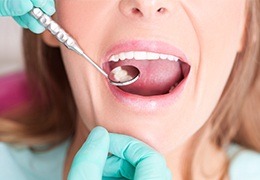 Patient receiving oral cancer screening