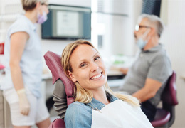 Woman smiling at dentist in Goodlettsville