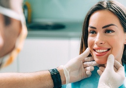 Woman having a dental consultation after dental crown restoration