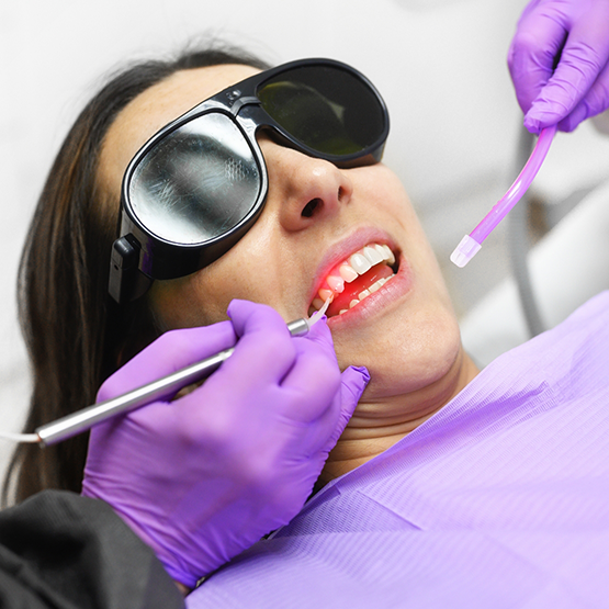 Dental patient having their gums treated with a soft tissue laser
