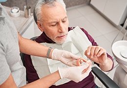 Man at dentist getting dentures