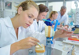 A female technician making a denture