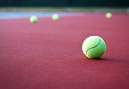 Tennis balls on empty court