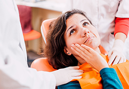 Pained woman visiting her Goodlettsville emergency dentist for toothache