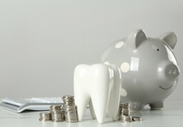 Tooth and piggy bank for cost of tooth extractions in Goodlettsville