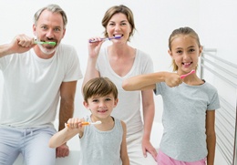 A family brushing their teeth