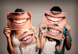A family with pictures of their mouths in front of their faces