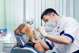 Woman at dentist for tooth-colored filling