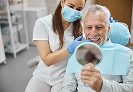 An aging gentleman happy with his new dental implant