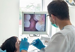 Dentist and patient looking at intraoral images