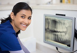 Dentist looking at dental x-rays