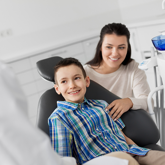 Young boy and his mother at a dental appointment