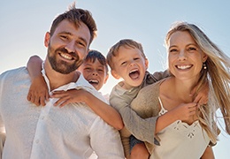 a family smiling outside in Goodlettsville