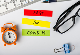 COVID-19 FAQs in Goodlettsville on colorful paper on desk