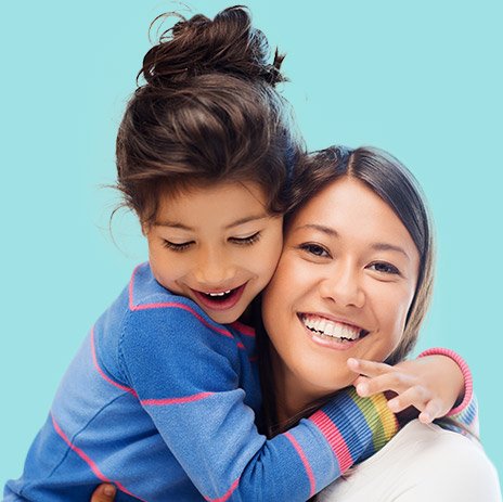 Mother and child smiling and hugging after visiting dentist in Goodlettsville