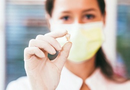 Dentist in Goodlettsville holding an extracted tooth