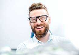 man smiling after getting veneers in Goodlettsville