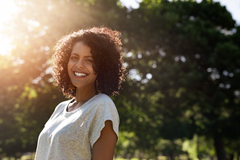 Woman smiling in sunlight