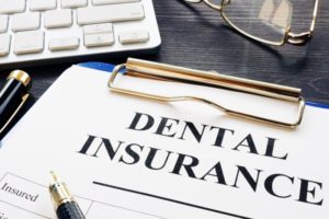 Goodlettsville dentist clipboard with dental insurance paperwork