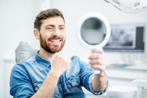 man smiling in mirror 