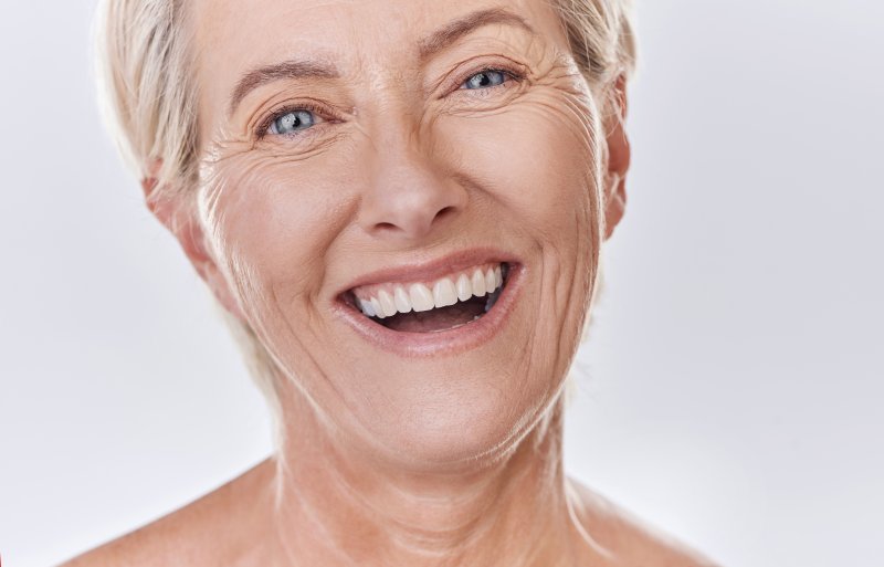 smiling seniors wearing dentures