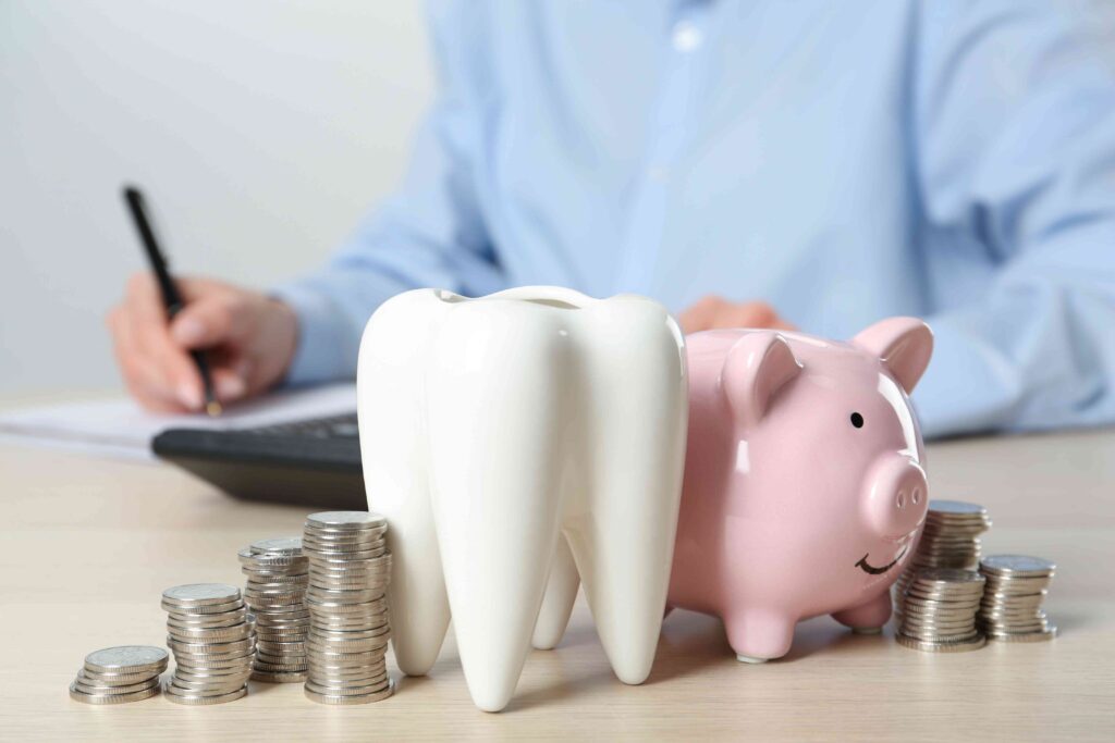Tooth next to a piggy bank