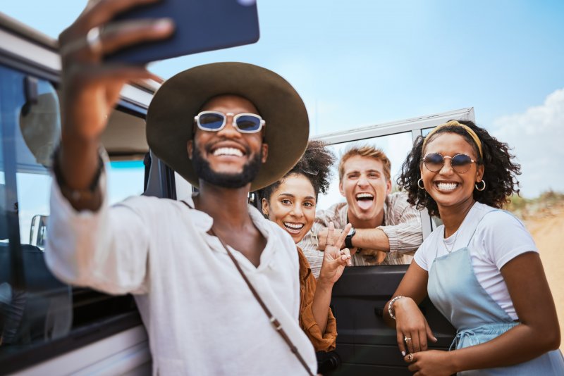 group of friends traveling and smiling together